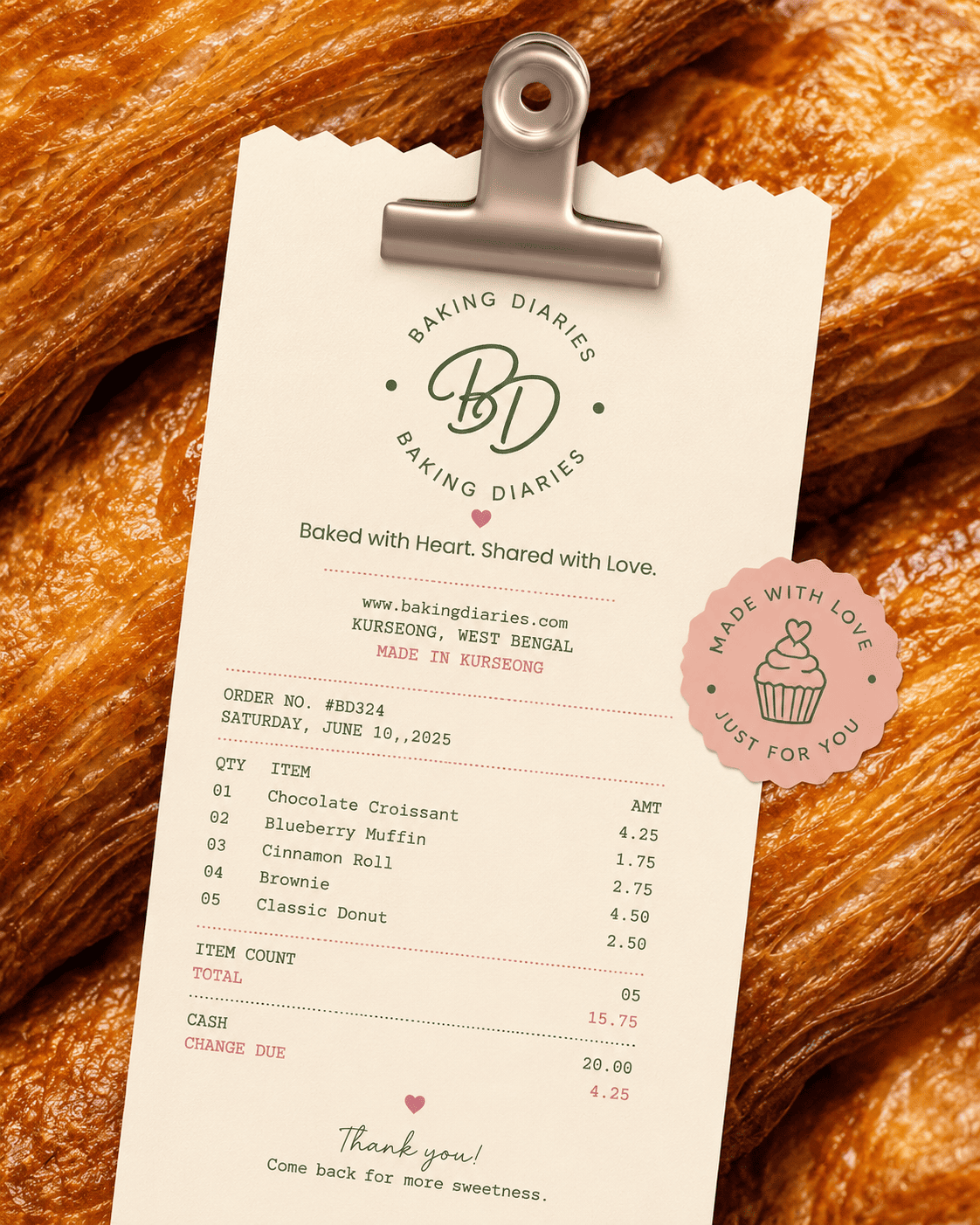 Baking Diaries branded receipt design resting on fresh pastries
