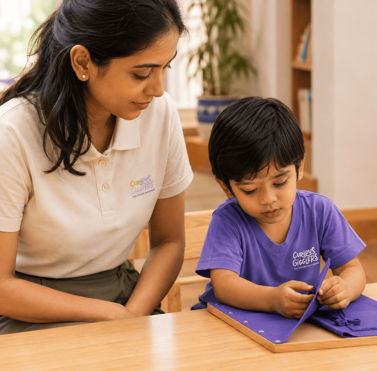 Curious Gigglers brand merchandise — teacher and child